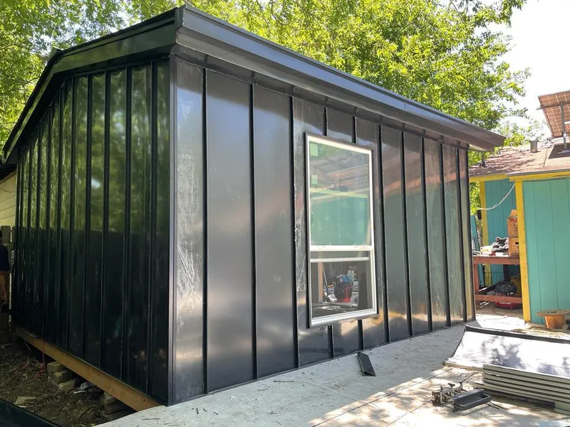 Black standing seam metal wall panels for Roof Inspection in Ash